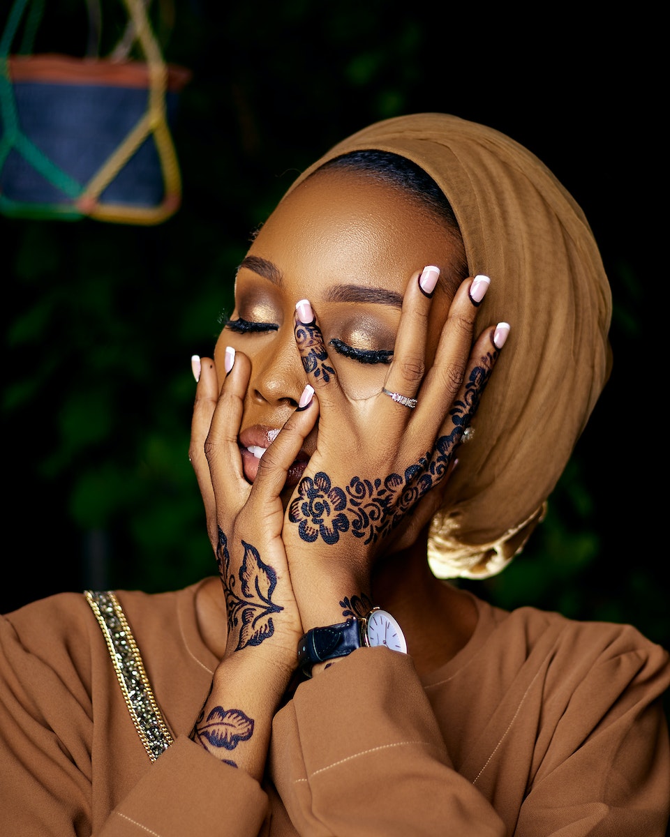 Woman Posing with Henna Tattoos on Hands